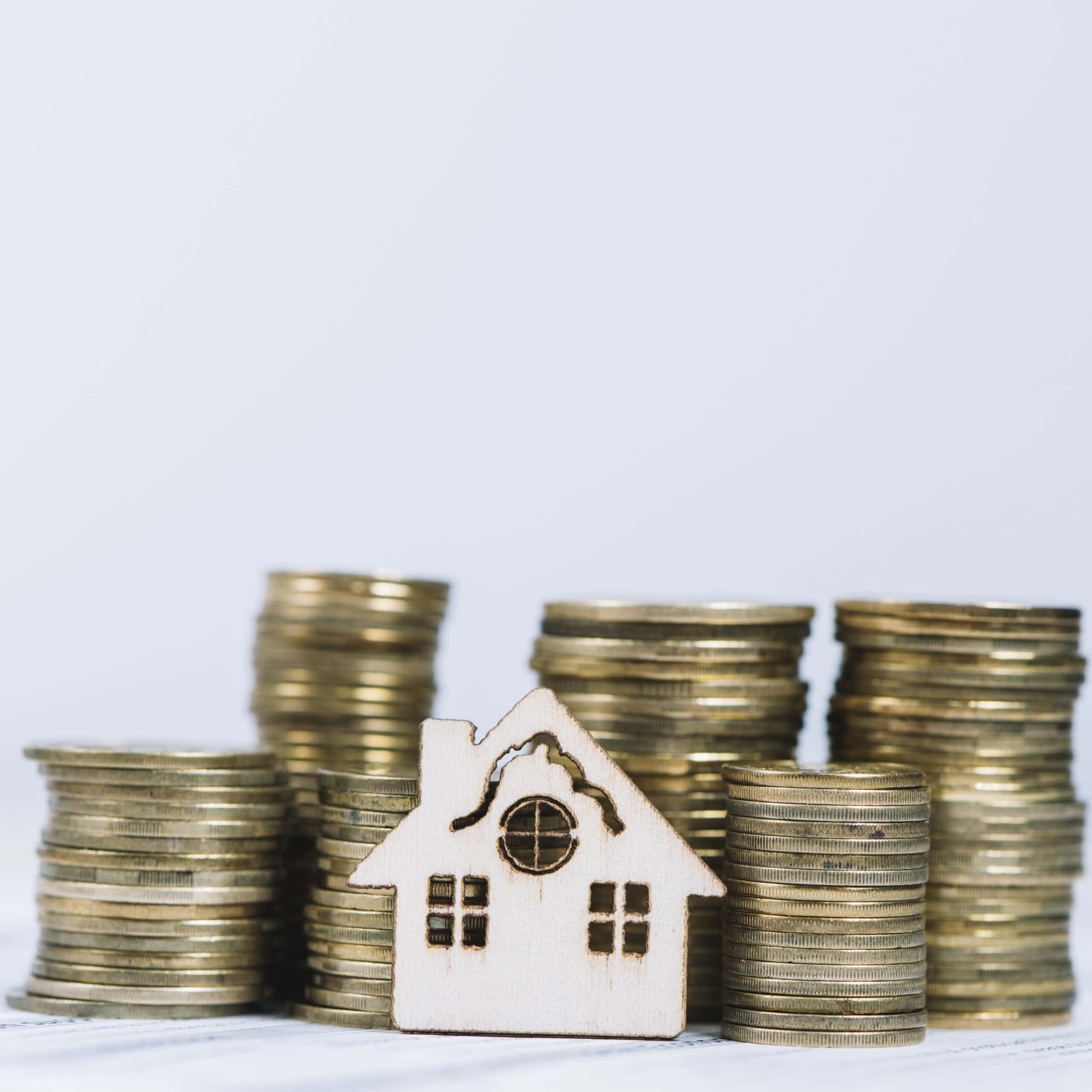 close-up-house-near-coins